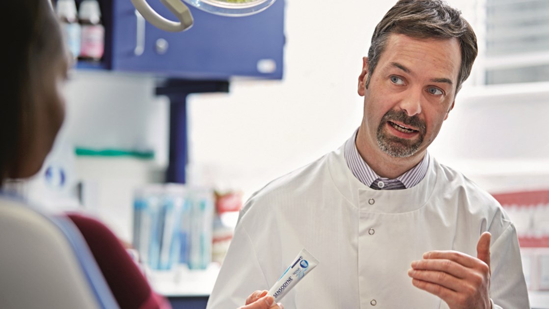 Mark Clough discussing Sensodyne with a patient