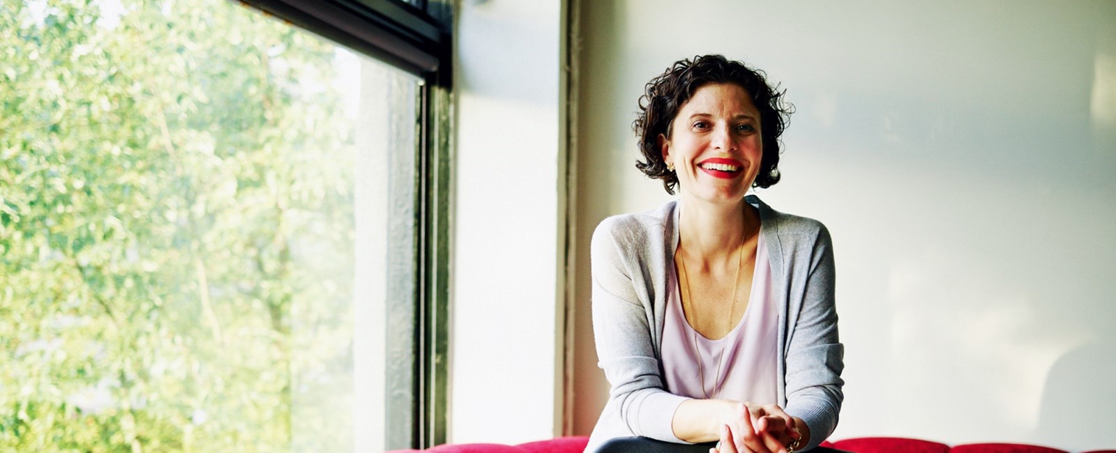 Woman laughing, showing her white teeth